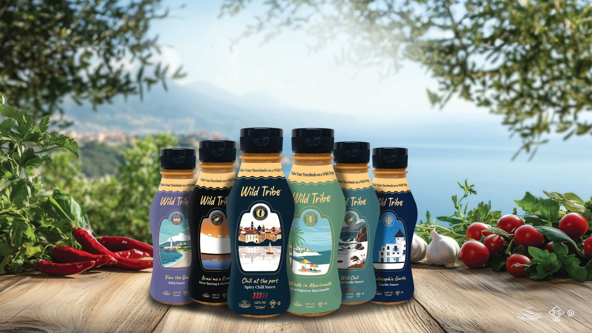 Bottles of Wild Tribe olive oil on a wooden surface with vegetables and a scenic background